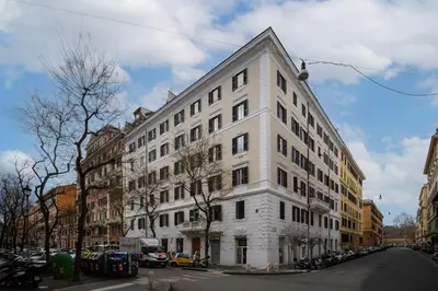 a large white building on a city street at Suite Apartment Prati in Rome