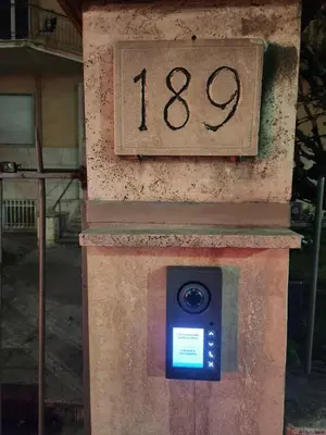 a digital camera on top of a stone clock at corso francia suite in Rome