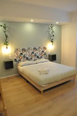 a bedroom with a large bed in a room at corso francia suite in Rome