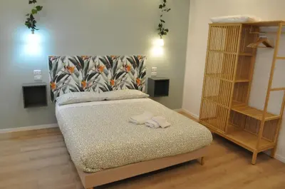 a bedroom with a bed with two towels on it at corso francia suite in Rome