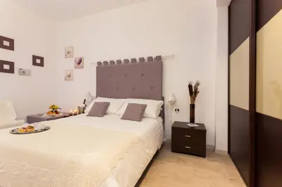 a bedroom with two beds with towels on them at Relais 155 Guest House in Rome