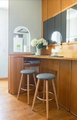 a kitchen with two stools at a kitchen counter at Vatican Home 51 in Rome