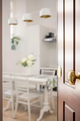 an open door in a room with a table and chairs at Parisi apt in Rome
