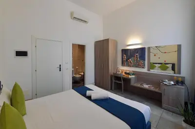 a bedroom with a bed and the eiffel tower at Suites Farnese Design in Rome