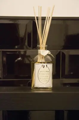 a bottle with straws in it on a table at Leoncino 36 Apartments in Rome in Rome