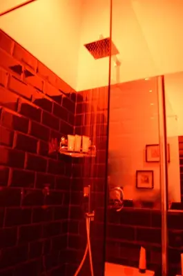 a bathroom with a shower with a glass door at Leoncino 36 Apartments in Rome in Rome