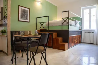 a room with a table and a bunk bed at Ton Ton by Ghor in Rome
