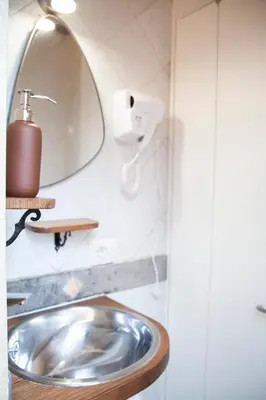 a bathroom with a sink and a mirror at Ton Ton by Ghor in Rome