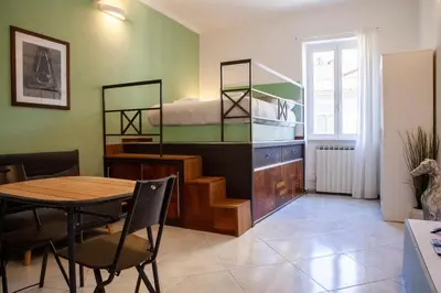 a room with a table and a bunk bed at Ton Ton by Ghor in Rome