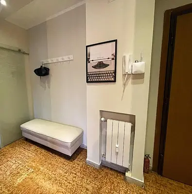 a room with a bed and a picture on the wall at La Casa Libre Metro A Colli Albani 350 m in Rome