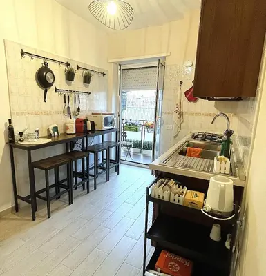 a kitchen with a sink and a counter top at La Casa Libre Metro A Colli Albani 350 m in Rome