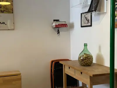a vase sitting on a table in a room at San Giovanni Apartment in Rome