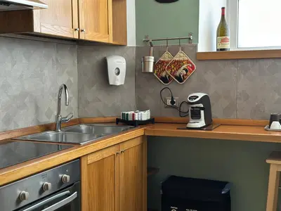 a kitchen with a sink and a counter top at San Giovanni Apartment in Rome
