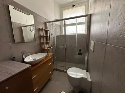 a bathroom with a shower and a toilet and a sink at San Giovanni Apartment in Rome
