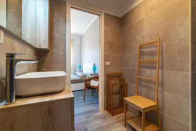 a bathroom with a sink and a mirror at GuestHost - Valle Aurelia Elegant Apartment in Rome
