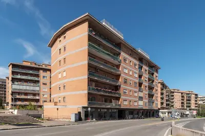 a tall building on the side of a street at GuestHost - Valle Aurelia Elegant Apartment in Rome