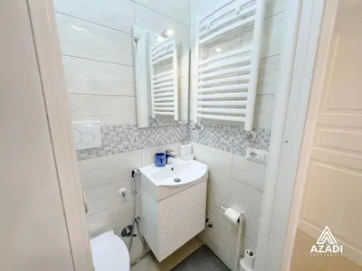 a small bathroom with a sink and a toilet at Azadi B&B Flaminio in Rome