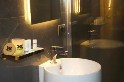 a bathroom with a sink and a mirror at XCross Suites Roma in Rome