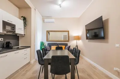 a kitchen and dining room with a table and chairs at Italy House in Rome