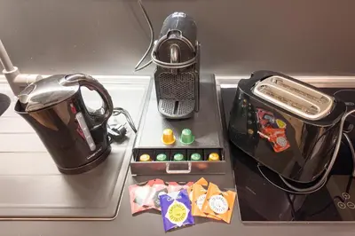 a tray with a tea pot and a tea kettle at Italy House in Rome