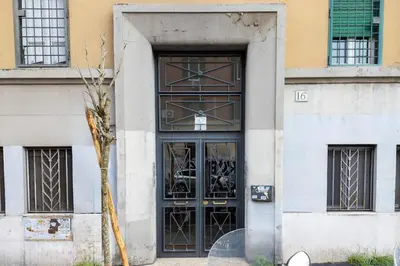 a door to a building with a tree in front at Italy House in Rome