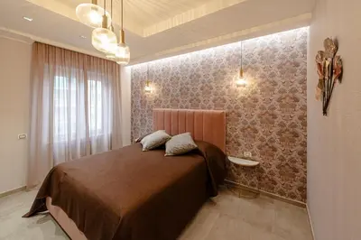 a bedroom with a bed with a brown bedspread at Bed & Breakfast Il Narciso in Rome