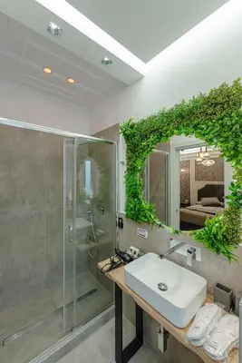 a bathroom with a sink and a shower and a mirror at Bed & Breakfast Il Narciso in Rome