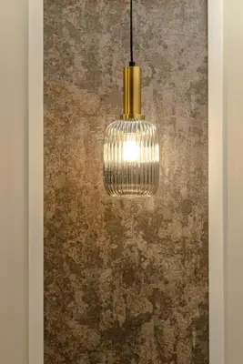 a pendant light hanging in front of a wall at Bed & Breakfast Il Narciso in Rome