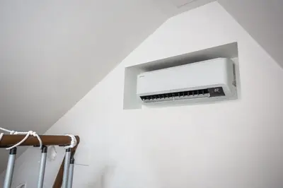 a wall mounted air conditioner on a white wall at Trastevere Double A LOFT in Rome