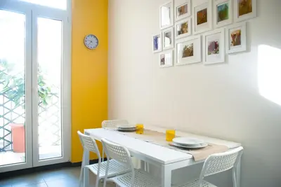 a dining room with a white table and chairs at Welcome Friends in Rome