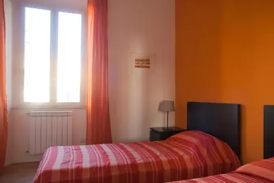 a room with two beds and a window at Welcome Friends in Rome
