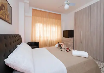 a hotel room with a bed and a television at Residenza dei Pontefici in Rome