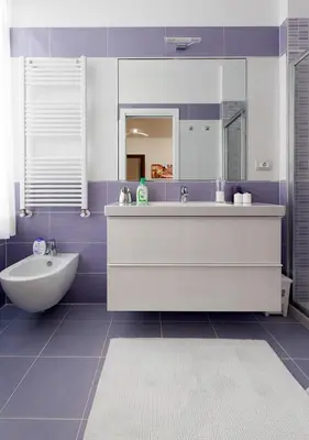 a bathroom with a tub and a sink and a mirror at Residenza dei Pontefici in Rome