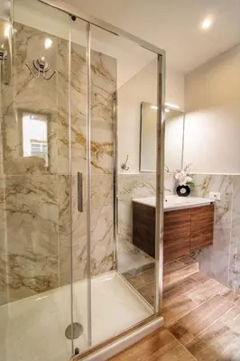 a bathroom with a shower and a sink at Lovely 2 Bedroom apartment by YourHost in Rome