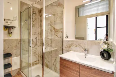 a bathroom with a shower and a sink at Lovely 2 Bedroom apartment by YourHost in Rome
