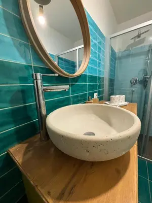 a bathroom with a sink and a mirror at Flaminia's House San Pietro Station in Rome