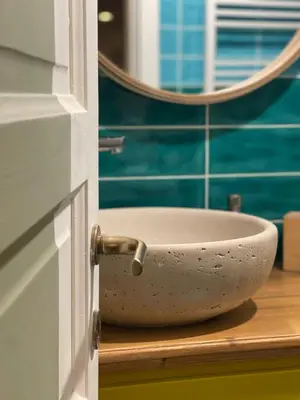 a white bowl on a counter in a bathroom at Flaminia's House San Pietro Station in Rome