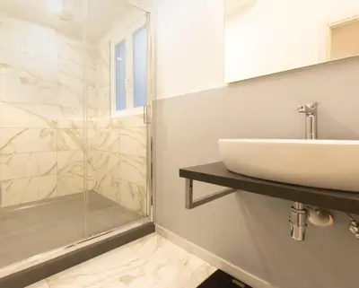 a bathroom with a sink and a shower at Cozy Tritone - My Extra Home in Rome
