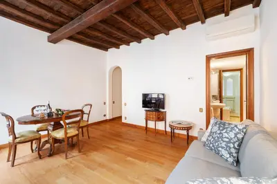 a living room with a couch and a table at Monti Charming Amphora Apartment in Rome