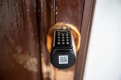 a remote control sticking out of a wooden door at Your elegant Loft at Termini Station in Rome