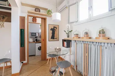 a kitchen with a glass table and some chairs at cos24 in Rome