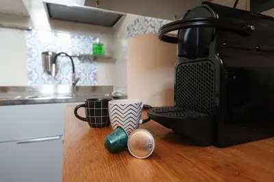 a kitchen counter with a coffee cup on a counter top at cos24 in Rome