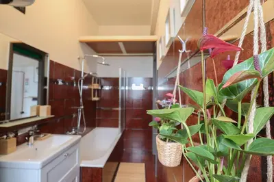 a bathroom with a sink and a toilet and a plant at cos24 in Rome