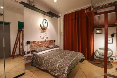 a bedroom with a bed and a table in it at cos24 in Rome