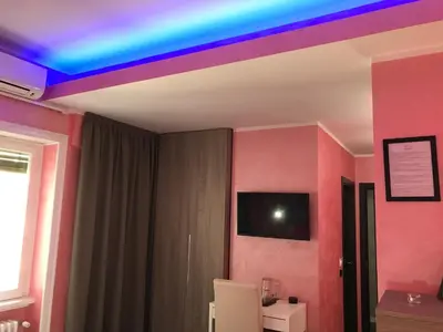 a room with a rainbow colored ceiling at B&B Roma in Rome