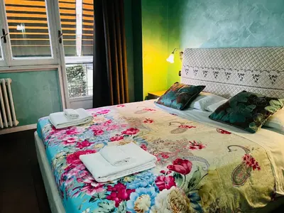 a bedroom with a bed with towels on it at B&B Roma in Rome