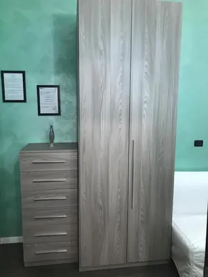 a bathroom with a toilet and lights on the wall at B&B Roma in Rome