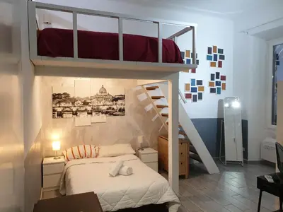 a bedroom with a bunk bed and a staircase at Casa Manzoni in Rome