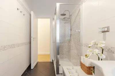 a bathroom with a shower and a sink at Bellina Suite at the Vatican in Rome