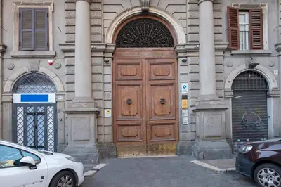 a large wooden door on the side of a building at STELLA GUEST HOUSE O AFFITTACAMERE in Rome